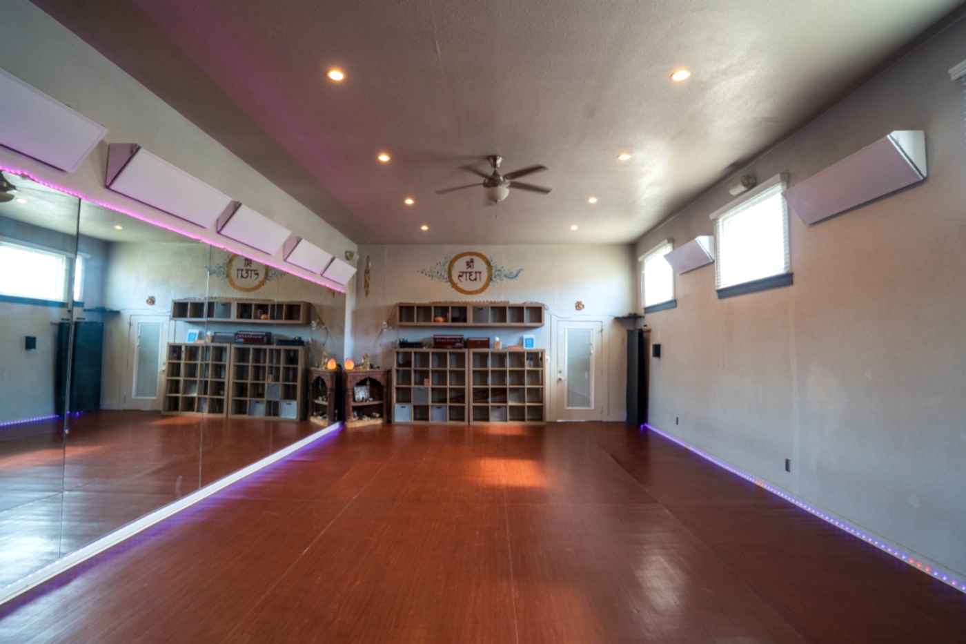 The warm, serene interior of Veda Yoga Center studio